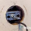 The Ultraloq U-Bolt Pro Wifi Smart Deadbolt exterior assembly and connector cable fed through deadbolt. The Ultraloq U-Bolt Pro Wifi Smart Deadbolt exterior assembly and connector cable fed through deadbolt