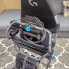 The Playseat Challenge X — Logitech G Edition sim racing seat folded up for storage